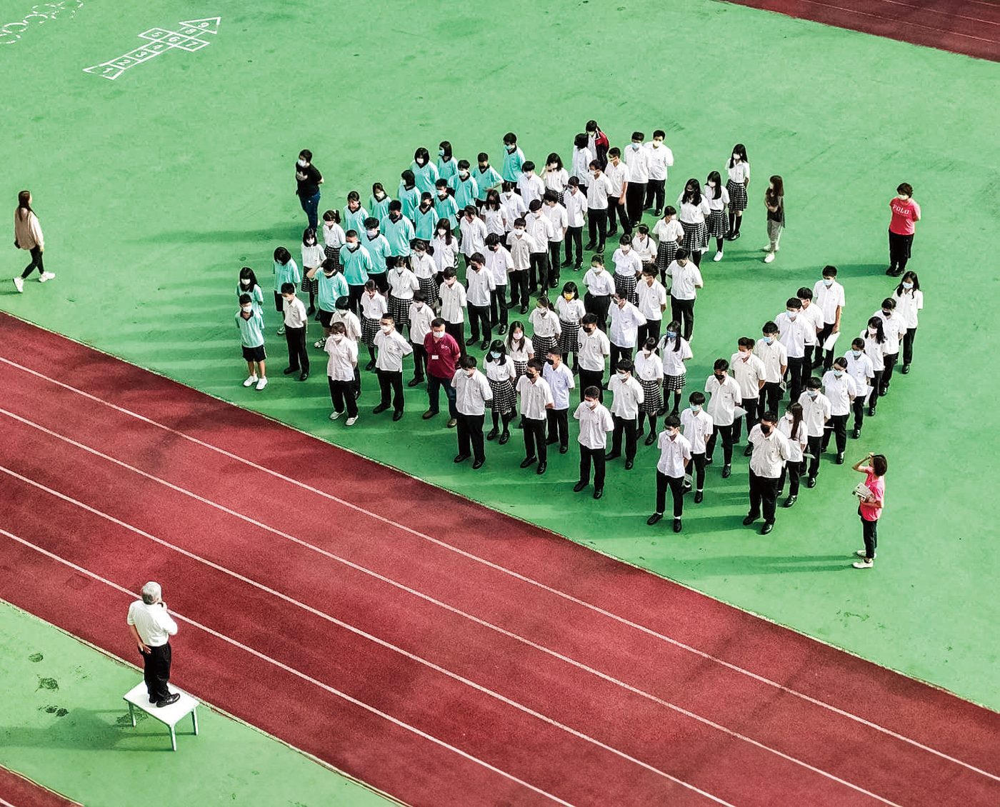 Students and teachers gathered on the school court for a morning assembly